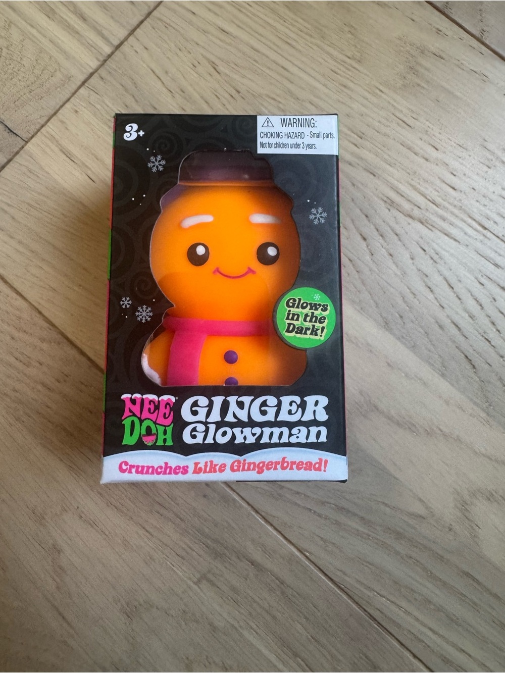 NeeDoh Crunchy Ginger Glowman Orange Glowman with Pink Scarf
